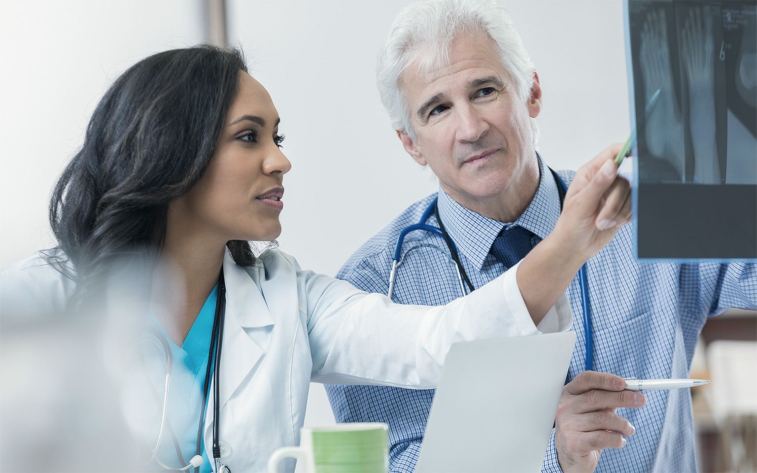 Doctors discussing foot X-ray