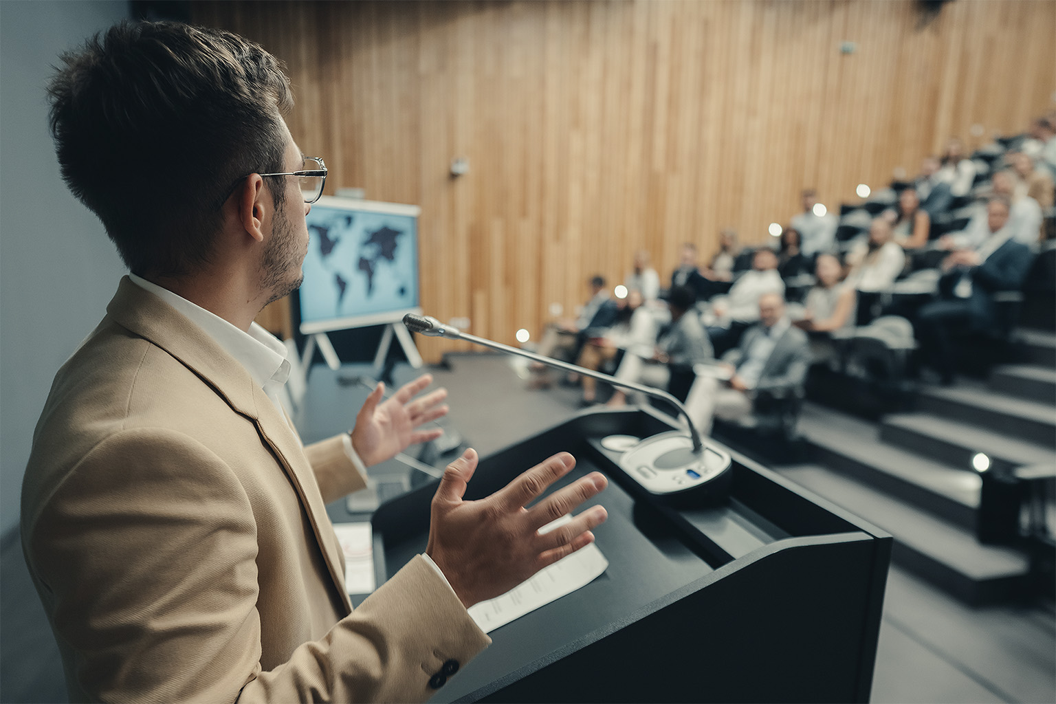 Speaker presenting at a global conference
