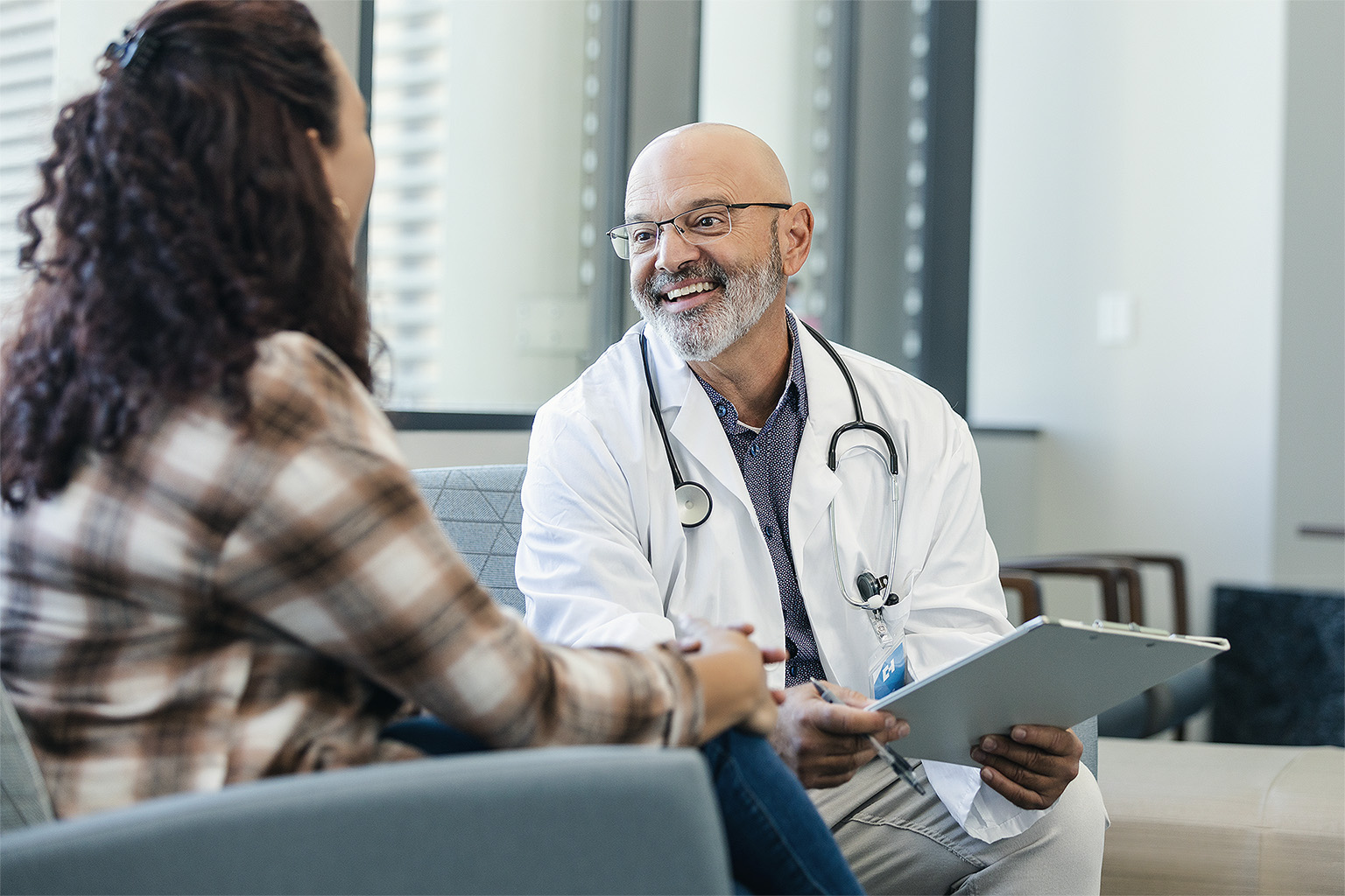 Doctor talking with patient