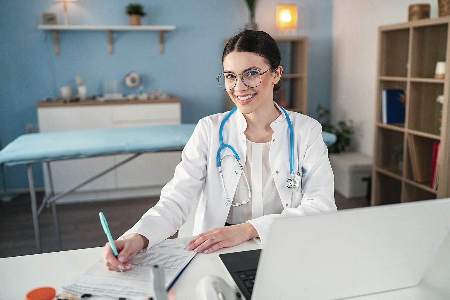 Doctor writing medical notes