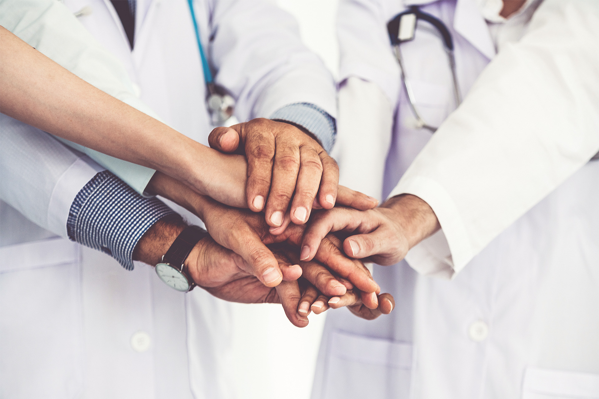 Healthcare people group joining hands